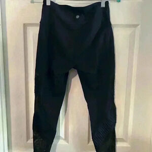 Athleta blue /black leggings with mesh on sides. Size Small.